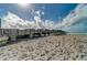 Wooden pier extending over sandy beach into ocean at 13510 Esposito St, Venice, FL 34293