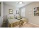 Charming bedroom with twin beds and plantation shutters at 13510 Esposito St, Venice, FL 34293