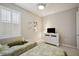 Cozy bedroom with twin beds, dresser, and plantation shutters at 13510 Esposito St, Venice, FL 34293