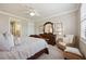 Well-appointed bedroom with sitting area and ensuite access at 13510 Esposito St, Venice, FL 34293