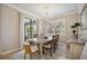 Bright dining room with chandelier and view to backyard at 13510 Esposito St, Venice, FL 34293