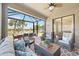 Spacious enclosed patio overlooking a serene lake view at 13510 Esposito St, Venice, FL 34293