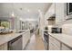 Modern kitchen with stainless steel appliances and granite countertops at 13510 Esposito St, Venice, FL 34293
