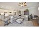 Open living space featuring a neutral couch and access to kitchen at 13510 Esposito St, Venice, FL 34293