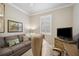 Multi-purpose room featuring sofa and workspace at 13510 Esposito St, Venice, FL 34293
