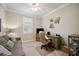 Bright and airy home office with desk and sofa at 13510 Esposito St, Venice, FL 34293