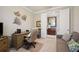 Home office with built-in desk and comfortable seating at 13510 Esposito St, Venice, FL 34293
