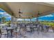 Community outdoor dining area with ceiling fans at 13510 Esposito St, Venice, FL 34293