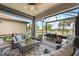 Relaxing screened patio with seating area and view of the water at 13510 Esposito St, Venice, FL 34293