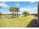 Peaceful water view from the backyard, featuring lush landscaping at 13510 Esposito St, Venice, FL 34293