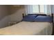Cozy bedroom featuring a full-size bed and window at 1739 Bonitas Cir # 1724C, Venice, FL 34293