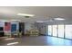 Community room with tables, chairs, and kitchen area at 1739 Bonitas Cir # 1724C, Venice, FL 34293