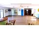 Bright community room with seating and a library at 1739 Bonitas Cir # 1724C, Venice, FL 34293