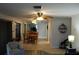 Dining area with a wood table, chairs, and view into the kitchen at 1739 Bonitas Cir # 1724C, Venice, FL 34293