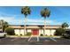 Building entrance with parking and landscaping at 1739 Bonitas Cir # 1724C, Venice, FL 34293