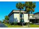 Tan building exterior with palm trees and landscaping at 1739 Bonitas Cir # 1724C, Venice, FL 34293
