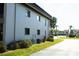 Exterior view of building showcasing landscaping at 1739 Bonitas Cir # 1724C, Venice, FL 34293