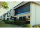 Exterior view of condo building, showcasing landscaping and building architecture at 1739 Bonitas Cir # 1724C, Venice, FL 34293