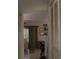 View down hallway showcasing access to living room and closet at 1739 Bonitas Cir # 1724C, Venice, FL 34293