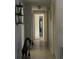 Long hallway with tile flooring and access to bedrooms at 1739 Bonitas Cir # 1724C, Venice, FL 34293
