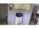 Kitchen corner with microwave, cabinets, and view into dining area at 1739 Bonitas Cir # 1724C, Venice, FL 34293