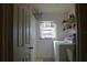 Laundry room with washer, dryer, and shelving at 1739 Bonitas Cir # 1724C, Venice, FL 34293