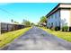 Paved road leading through a residential community at 1739 Bonitas Cir # 1724C, Venice, FL 34293