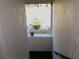 Interior stairwell with a small window overlooking a courtyard at 1739 Bonitas Cir # 1724C, Venice, FL 34293