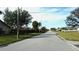 Residential street lined with houses and landscaping at 1739 Bonitas Cir # 1724C, Venice, FL 34293