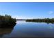 Calm waterway with lush mangrove trees at 1739 Bonitas Cir # 1724C, Venice, FL 34293