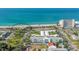 Aerial view of beach, building, and ocean at 21042 Anclote Ct, Venice, FL 34293