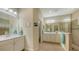Bathroom with double vanity, large shower and tile flooring at 21042 Anclote Ct, Venice, FL 34293