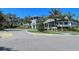 Grand Palm community clubhouse with palm trees at 21042 Anclote Ct, Venice, FL 34293