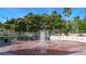 Refreshing community fountain with benches, surrounded by lush landscaping at 21042 Anclote Ct, Venice, FL 34293