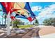 Brick plaza with colorful shade structure and seating at 21042 Anclote Ct, Venice, FL 34293