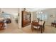 Spacious dining area with a view into the living room and kitchen at 21042 Anclote Ct, Venice, FL 34293