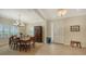 Bright dining room featuring a wooden table, chandelier, and built-in hutch at 21042 Anclote Ct, Venice, FL 34293