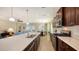 Open concept kitchen with island, stainless steel appliances, and hardwood cabinets at 21042 Anclote Ct, Venice, FL 34293