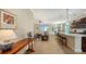 Open kitchen with island, hardwood cabinets, and view of living room at 21042 Anclote Ct, Venice, FL 34293