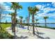 Peaceful lakeside area with hammocks and palm trees at 21042 Anclote Ct, Venice, FL 34293