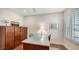 Home office featuring a desk, file cabinet, and window at 21042 Anclote Ct, Venice, FL 34293
