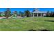 playground with play structures and shaded picnic area at 21042 Anclote Ct, Venice, FL 34293