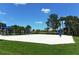 Beach volleyball court with a surrounding grassy area at 21042 Anclote Ct, Venice, FL 34293