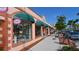 Storefront shops with awnings and merchandise displays at 21042 Anclote Ct, Venice, FL 34293