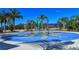 Community spray park with palm trees and shaded seating areas at 21042 Anclote Ct, Venice, FL 34293