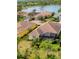 Aerial view of home and community near lake at 21208 Sandal Foot Dr, Venice, FL 34293