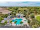 Resort-style pool with a spa and covered seating areas at 21208 Sandal Foot Dr, Venice, FL 34293
