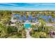Community pool with lake views and a relaxing atmosphere at 21208 Sandal Foot Dr, Venice, FL 34293