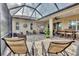 Relaxing screened lanai with lounge chairs and seating area at 21208 Sandal Foot Dr, Venice, FL 34293