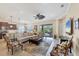 Spacious living area with comfy seating, large TV, and access to patio at 21208 Sandal Foot Dr, Venice, FL 34293